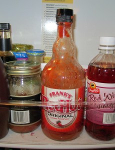 condiements in a refrigerator door