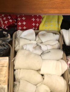 a sock drawer organized with inexpensive bins