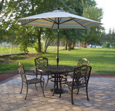 paver patio with wrought-iron table and chairs