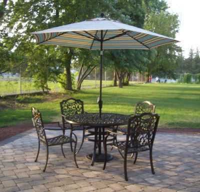 paver patio with wrought iron patio table and chairs