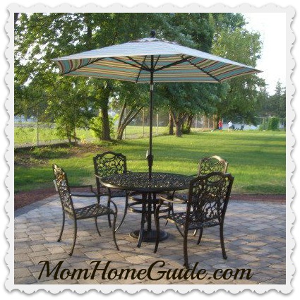 paver patio, wrought iron table, chairs, chain link fence, privacy