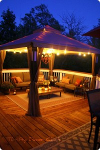 beautiful outdoor deck with lighted gazebo