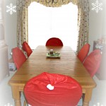 farmhouse table, kitchen, oiled bronze chandelier, santa hat chair covers