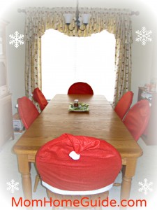 farmhouse table, kitchen, oiled bronze chandelier, santa hat chair covers