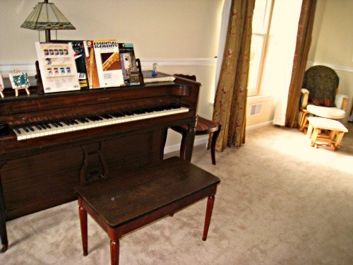 living room with piano