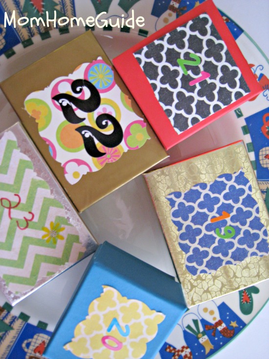 advent calendar boxes decorated with scrapbook paper for Christmas