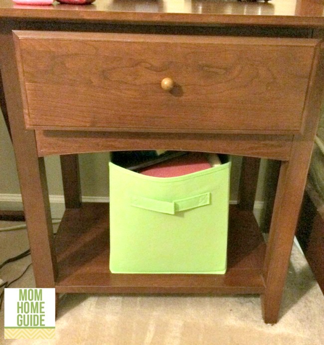 nightstand with fabric organizing bin for magazines and books