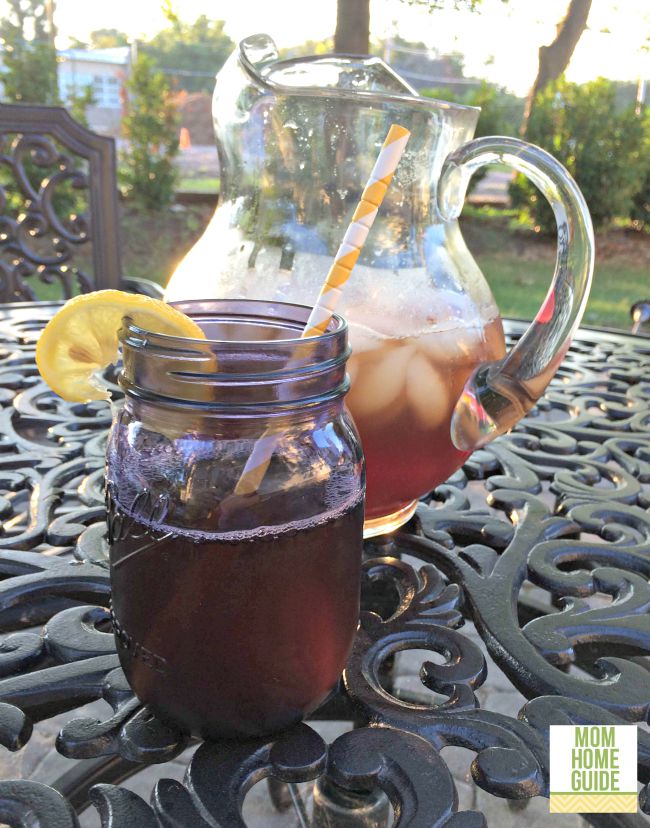 Sweet tea with lemon in a mason jar with a paper straw