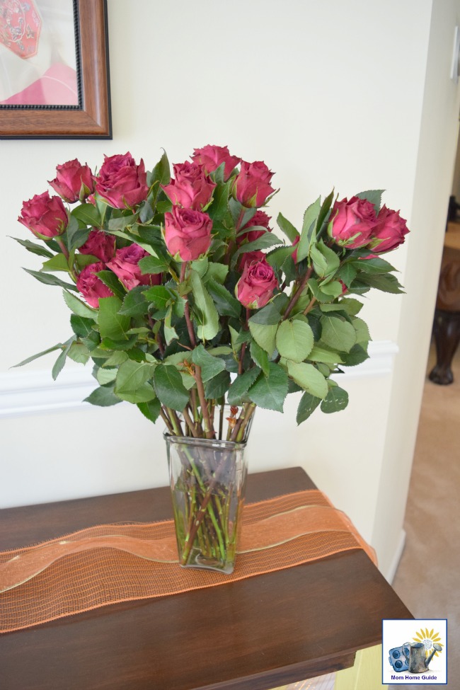 I love the way this vase of red roses looks on my DIY chalk painted and stained console table!