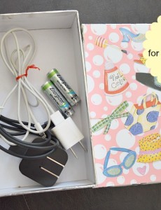 A decorated gift box makes great storage for storage of gear for cell phones and electronics