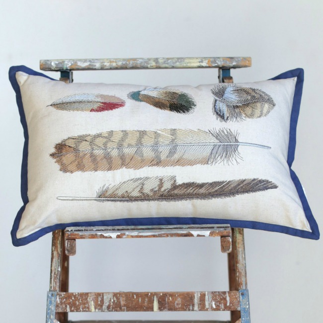 I love this embroidered feathers throw pillow!