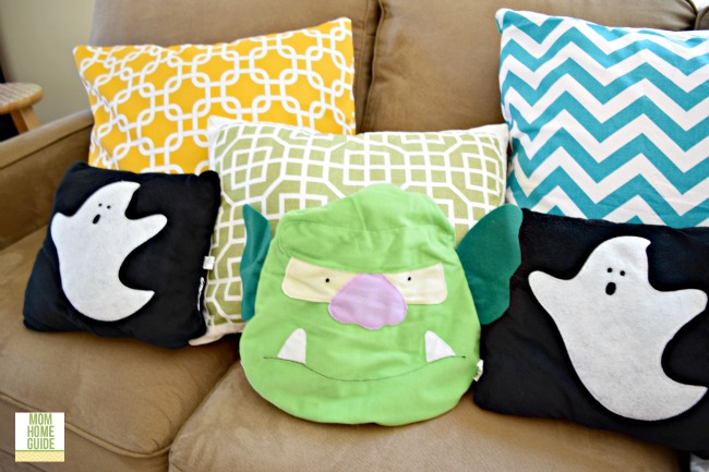 Halloween throw pillows on love seat