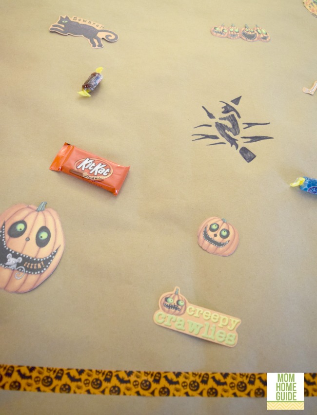 Stencil inexpensive Kraft paper for a fun Halloween table runner that kids can decorate!