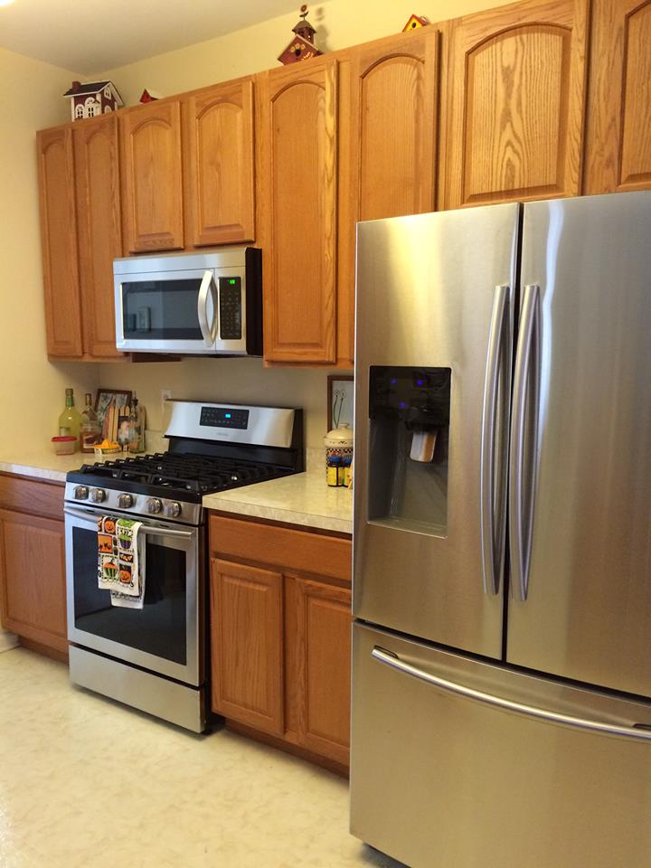 My home's kitchen with oak cabinets