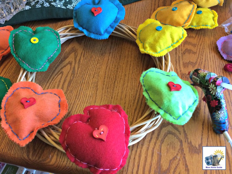 Felt hearts hot glued on a grapevine wreath for Valentine's Day