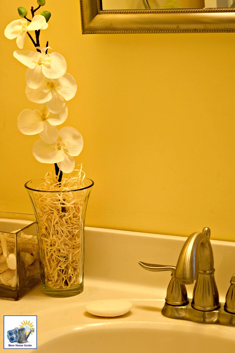 bathroom with faux flowers