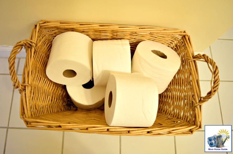 i like to keep a basket filled with extra rolls of toilet paper in my guest bathroom for guests