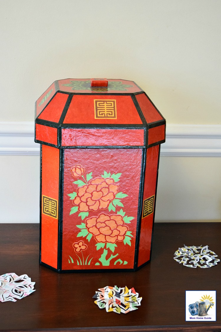 Console table decorated for spring with scrapbook paper punch outs