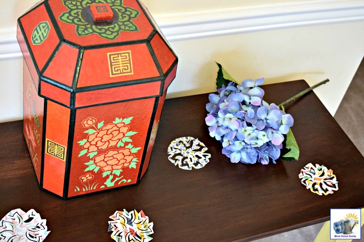 Spring console table decorated with scrapbook paper cutouts