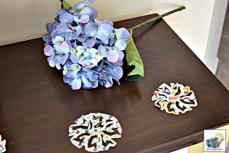Colorful paper scatters on a DIY stained and Annie Sloan chalk painted console table