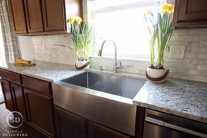 Beautiful kitchen remodel with marble backsplash, granite counters, and new appliances from Frigidaire and Lowe's