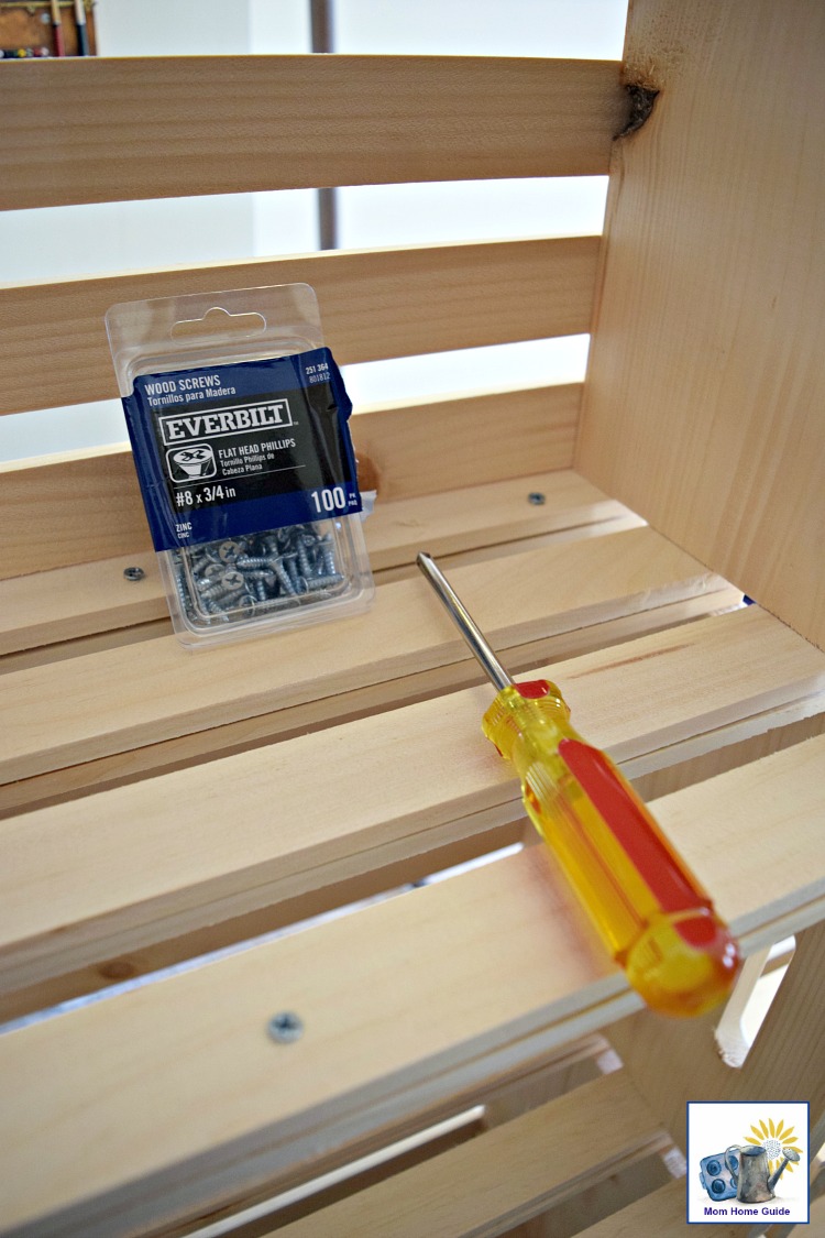 Screw wooden crates together to create a bookshelf or shelving for a closet.
