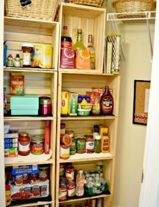 Easily convert a coat closet into a cute pantry by screwing some inexpensive wooden crates together