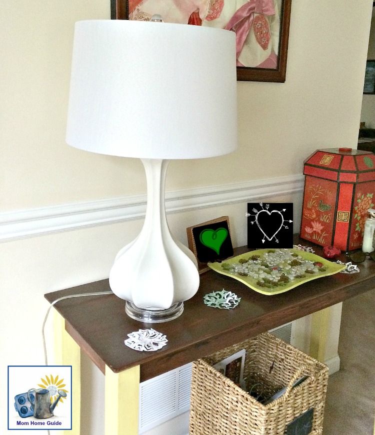 white ceramic gourd lamp on a chalk painted console table