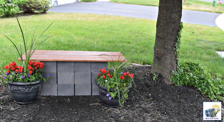 Easy DIY wood and cinder block bench underneath a shade tree