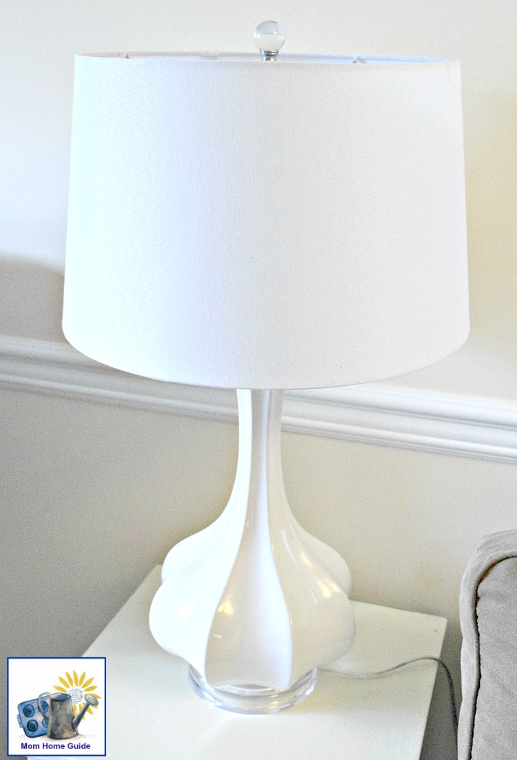 white table on a white side table in a living room