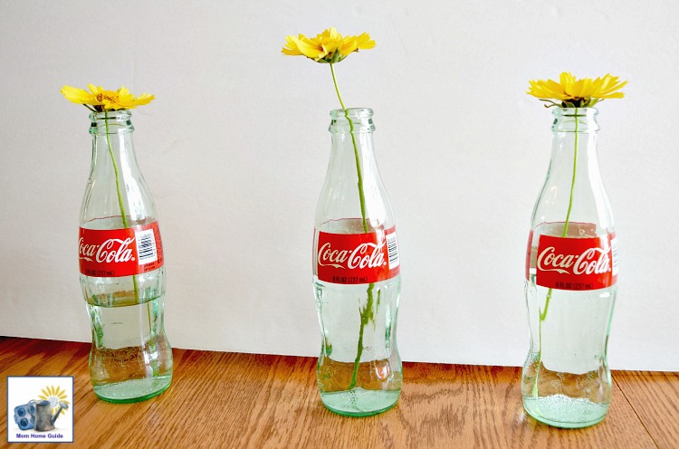 Wildflowers in Coca-Cola bottle vases