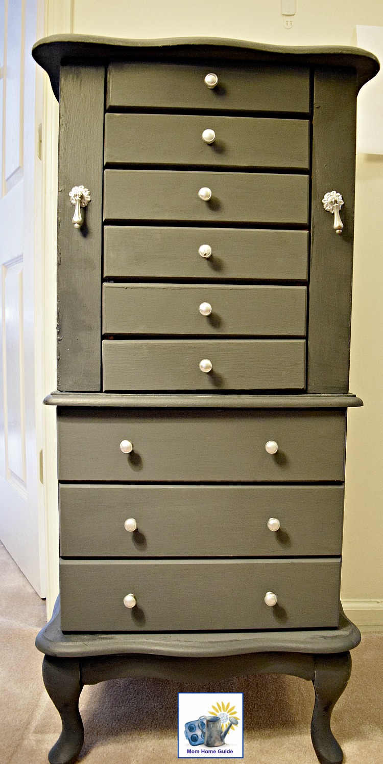 A newly chalk painted jewelry armoire in relic