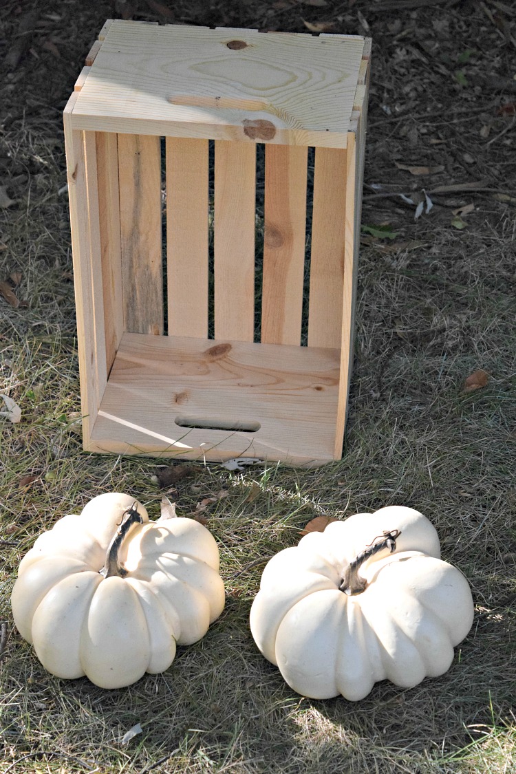 unpainted wood crate and faux white pumpkins