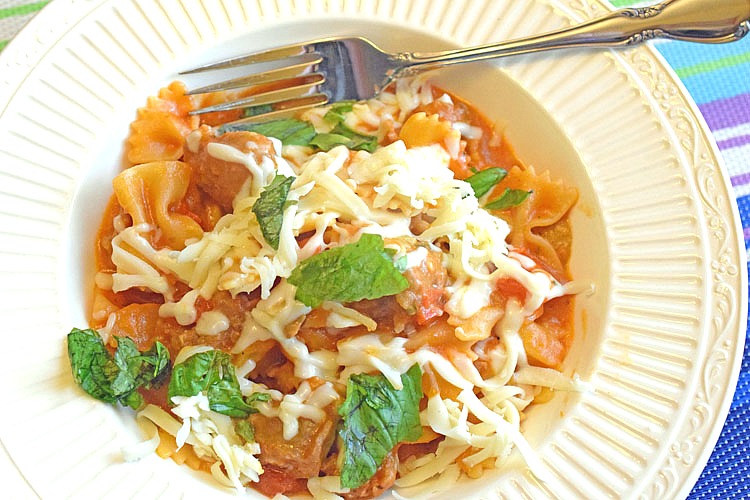 easy and delicious one-pot pasta recipe with farfalle pasta, sausage, mushrooms, red peppers and shredded mozzarella cheese