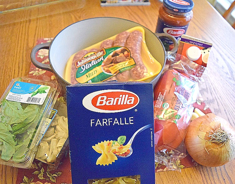 ingredients for a cheesy sausage pasta dish