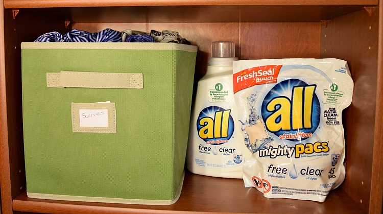 Using, pretty cloth bins, you can create "closet" space in a simple bookcase.