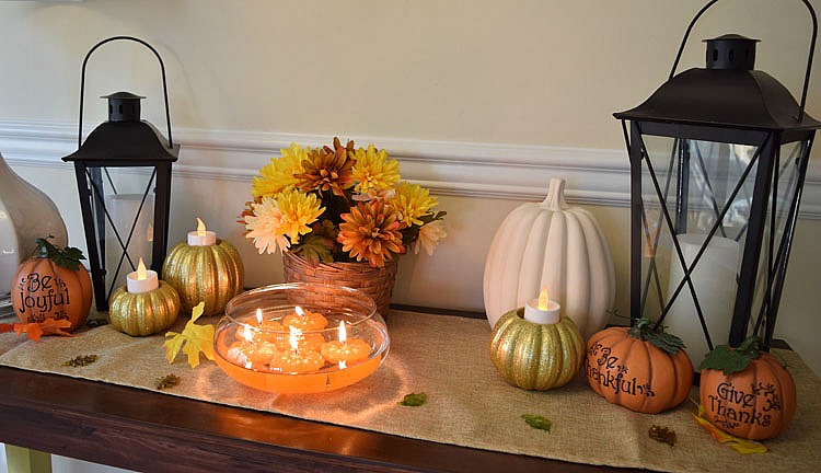 Thanksgiving console table with floating pumpkin candles