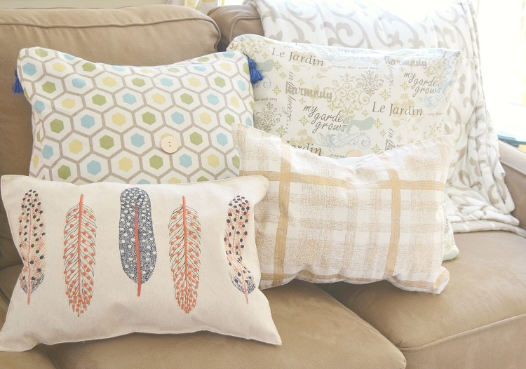 Fall pillows on a living room sofa