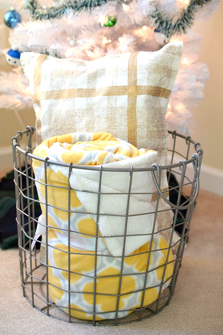 Wire mesh basket storage for extra winter and fall pillows and blankets