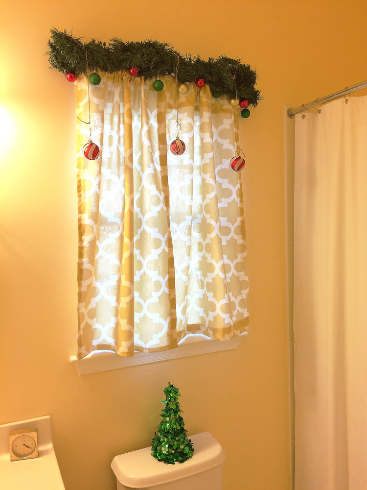 a bathroom decorated for the Christmas holiday