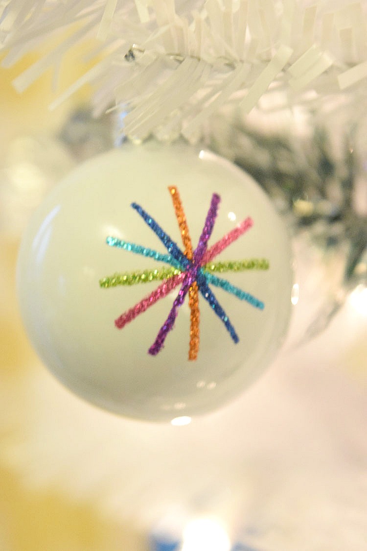Starburst ornament in white Christmas tree