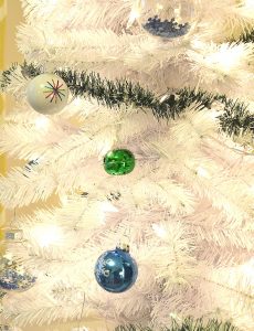 white Christmas tree with blue and green ornaments