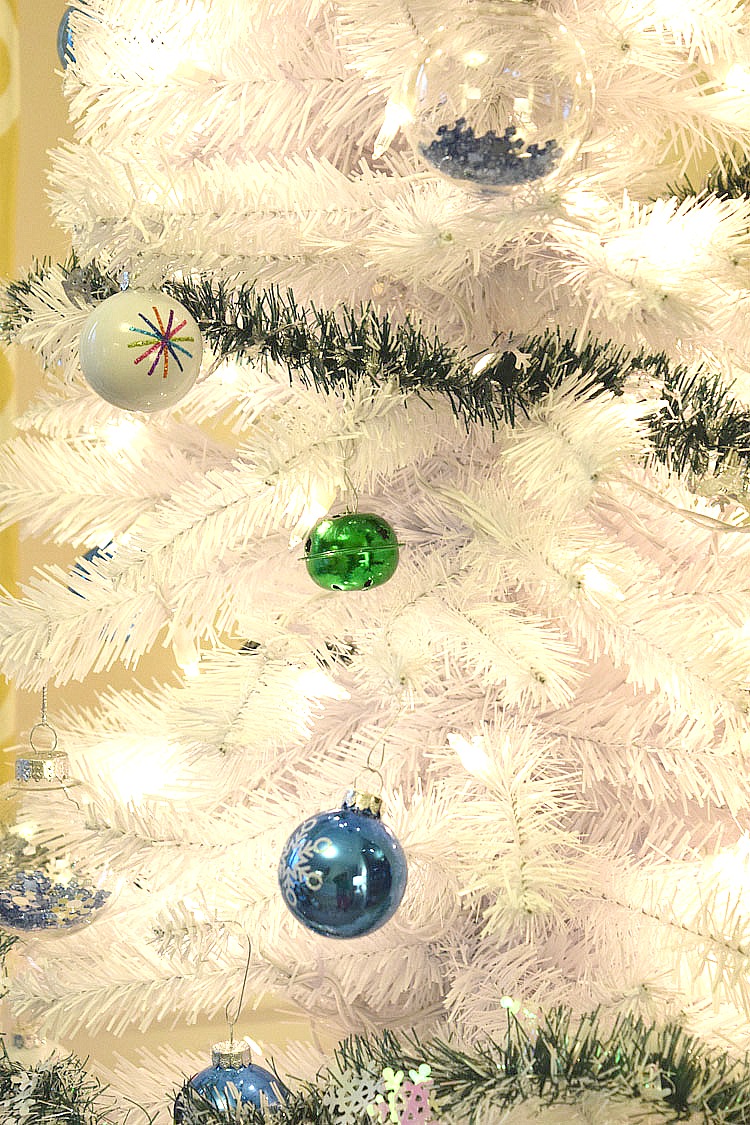 white Christmas tree with blue and green ornaments