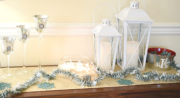 Christmas console table decorated in winter whites