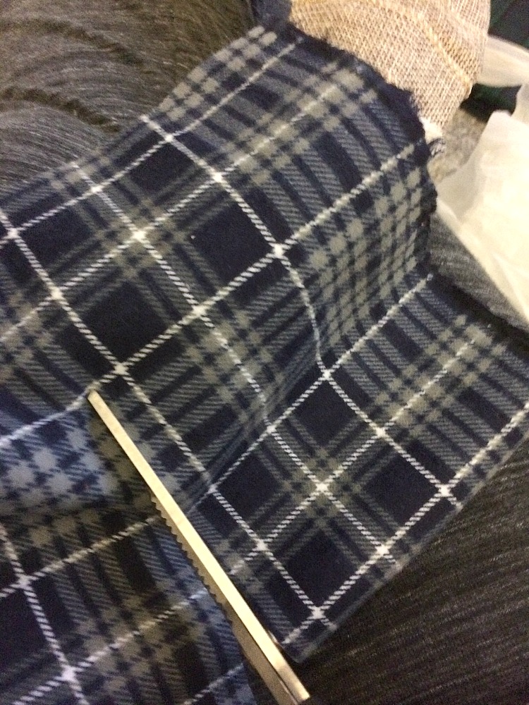 Cutting and fraying flannel for a winter wreath