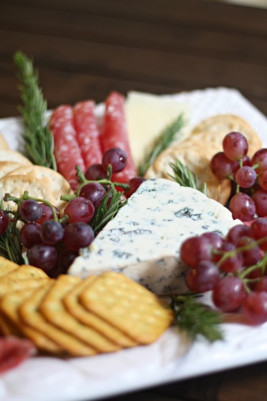 meat and cheese platter with grapes