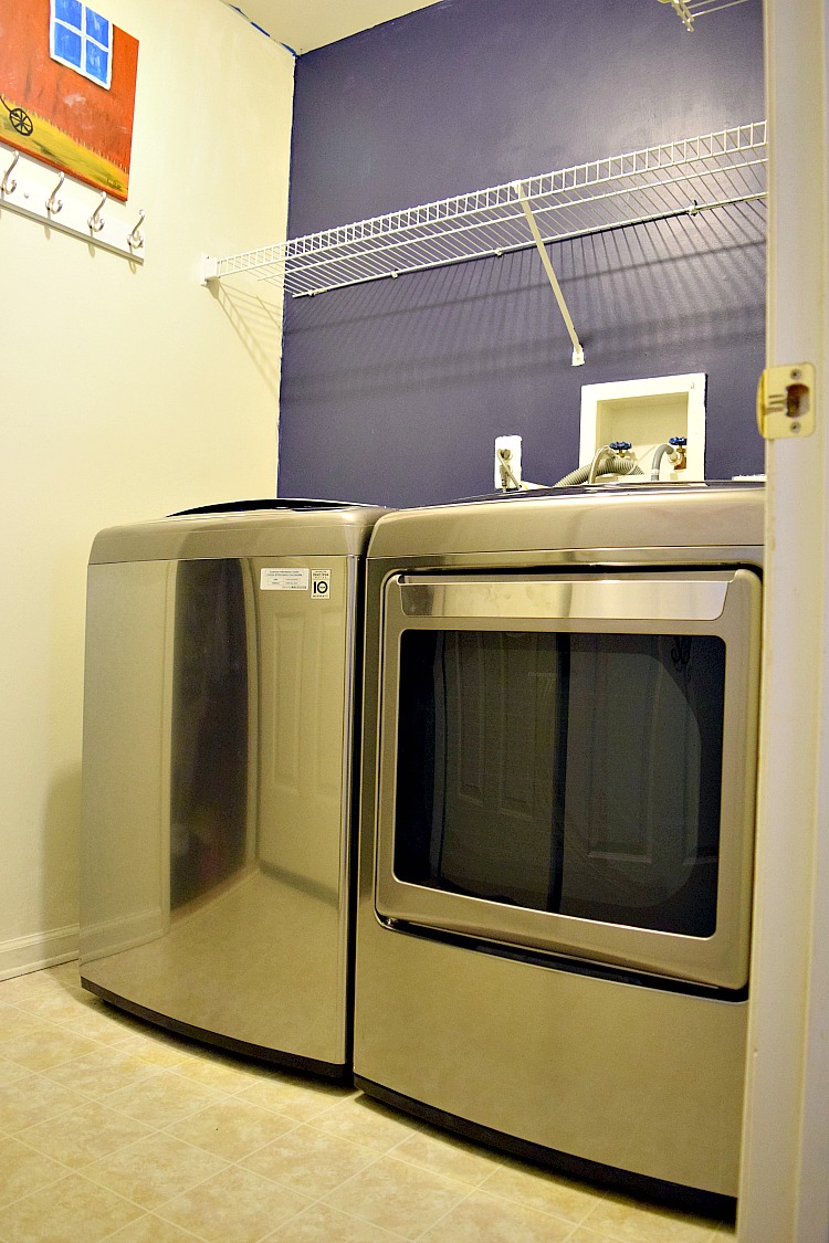 new laundry room with stainless steel washer and dryer