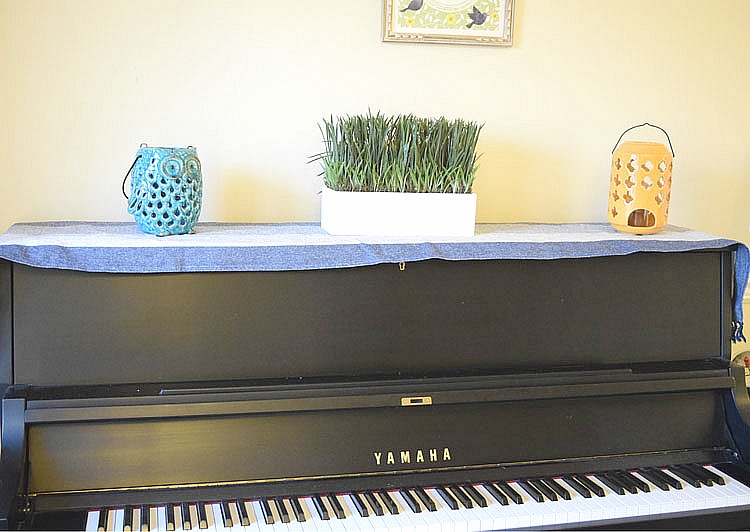 decorated black upright Yamaha piano