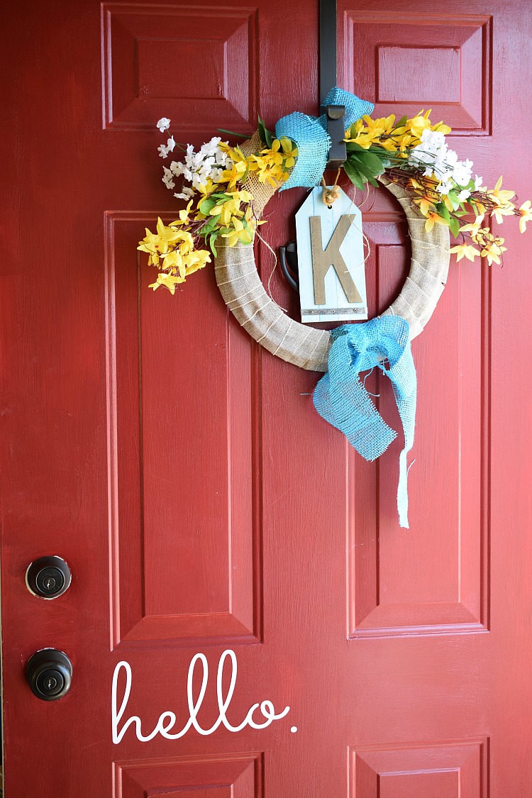 forsythia floral dollar store wreath on a Hello front door
