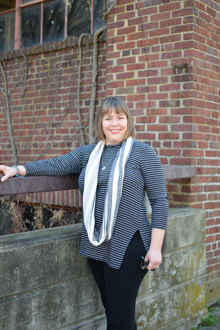 Lauren of Mom Home Guide wearing a blue and white striped long sleeved shirt from Old Navy, a blue and white scarf from The Gap and a pair of black yoga pants.